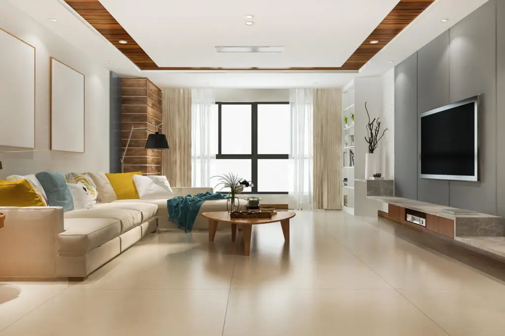 Living room with sofa, round coffee table, and TV.
